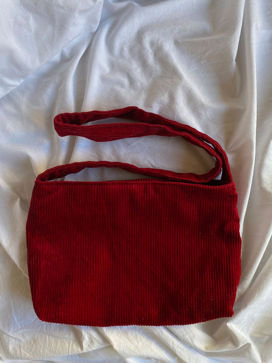 Corduroy in red bag